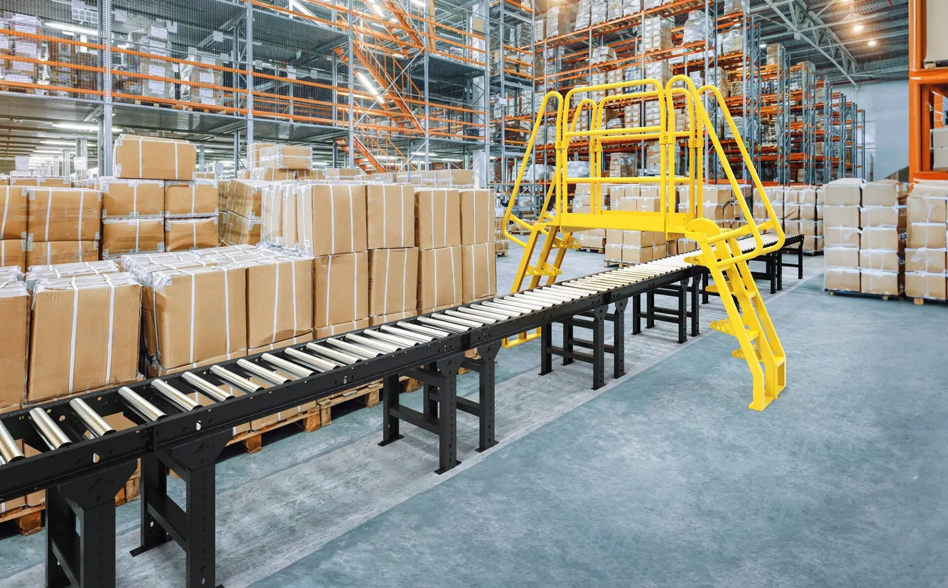 A spacious warehouse with numerous boxes stacked inside, featuring industrial crossover stairs for accessibility