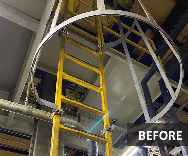 metal ladder that is next to a building