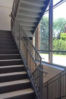 Metal stair with poured concrete treads